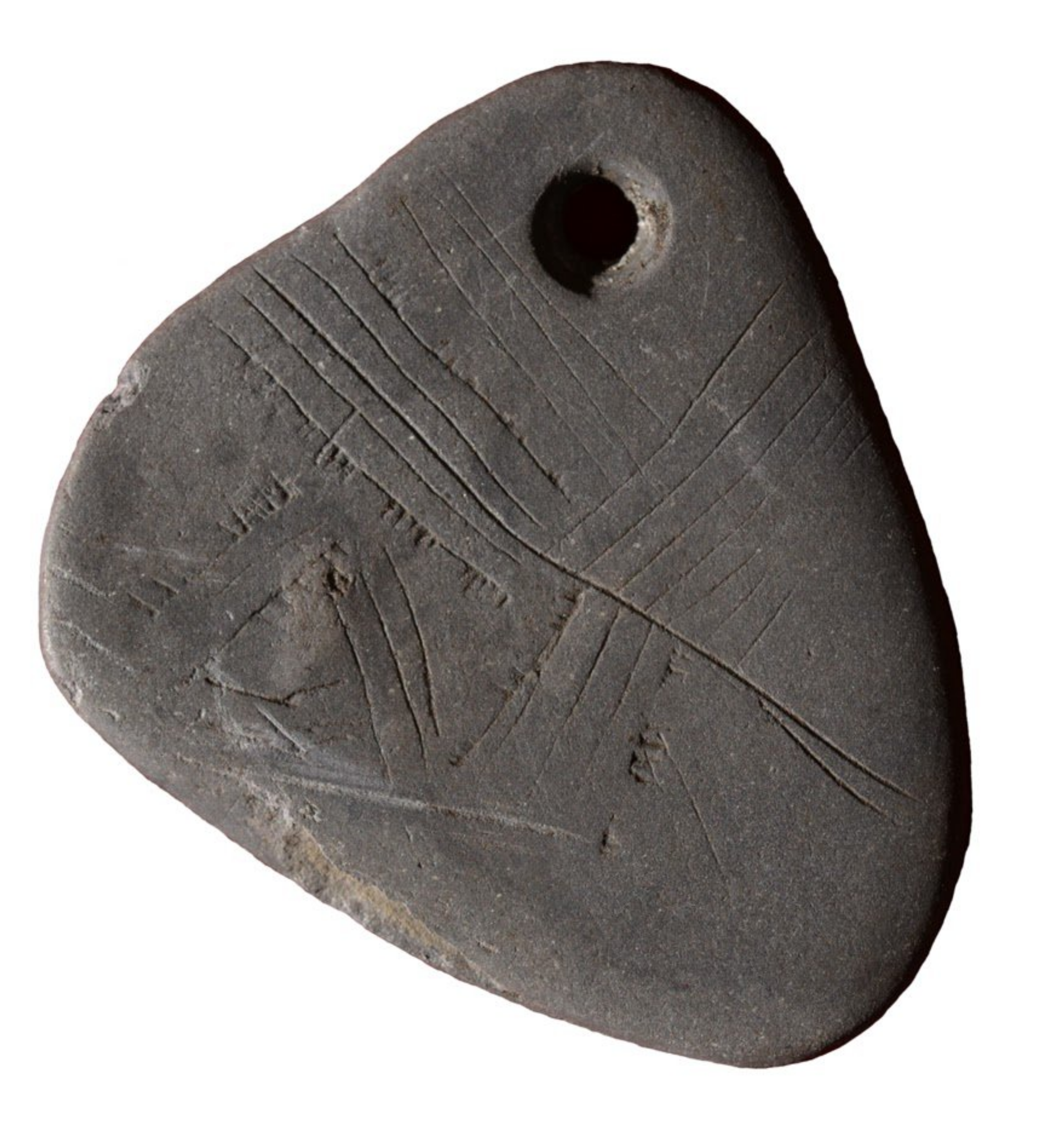 A image of a mesolitic shale pedant with decoration